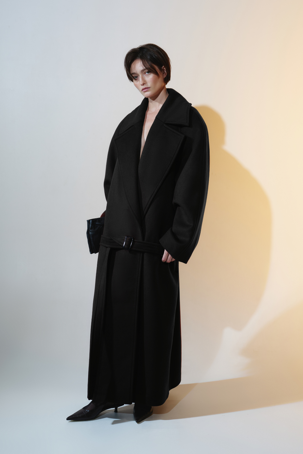 Black long coat with a low waist