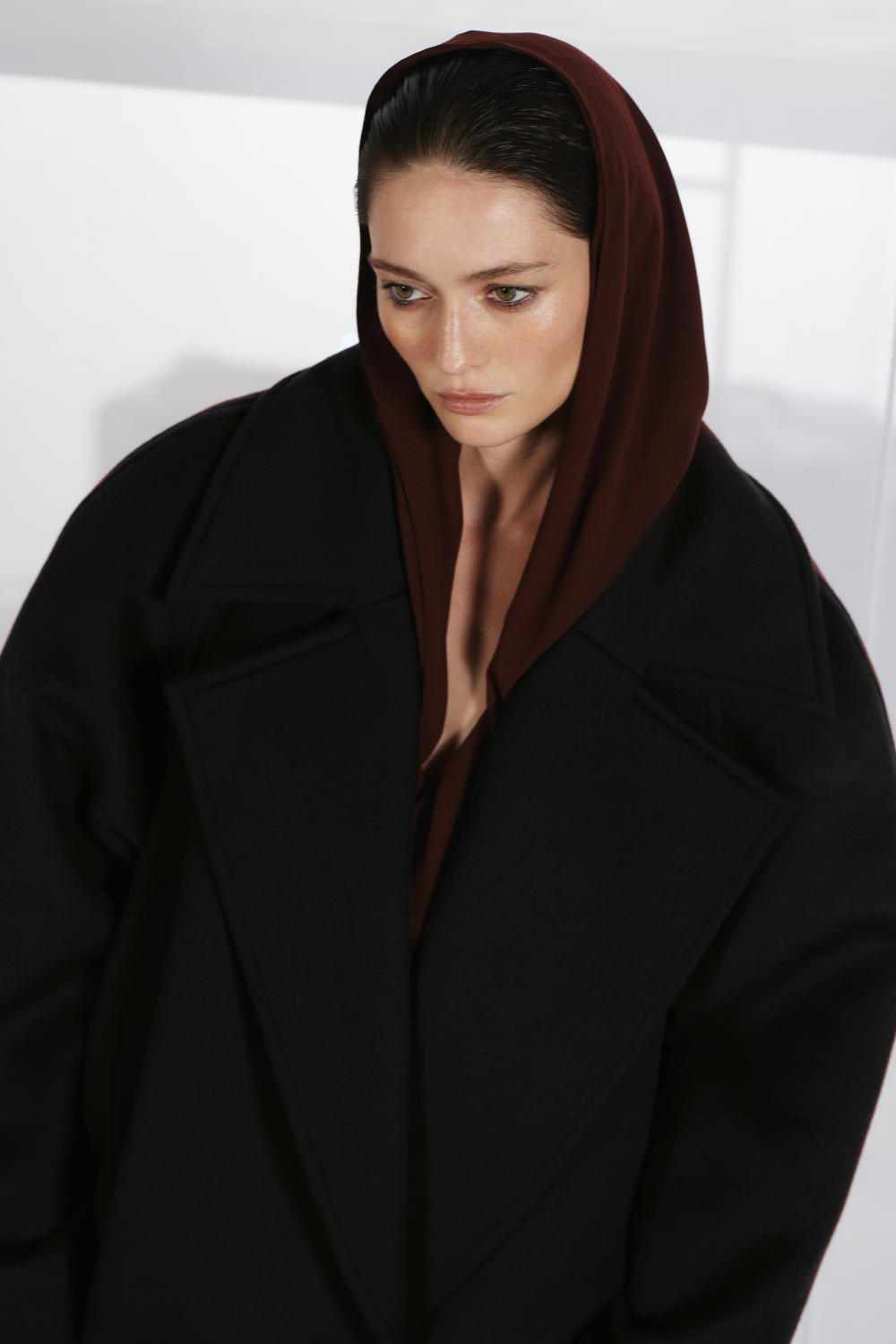 Black long coat with a low waist