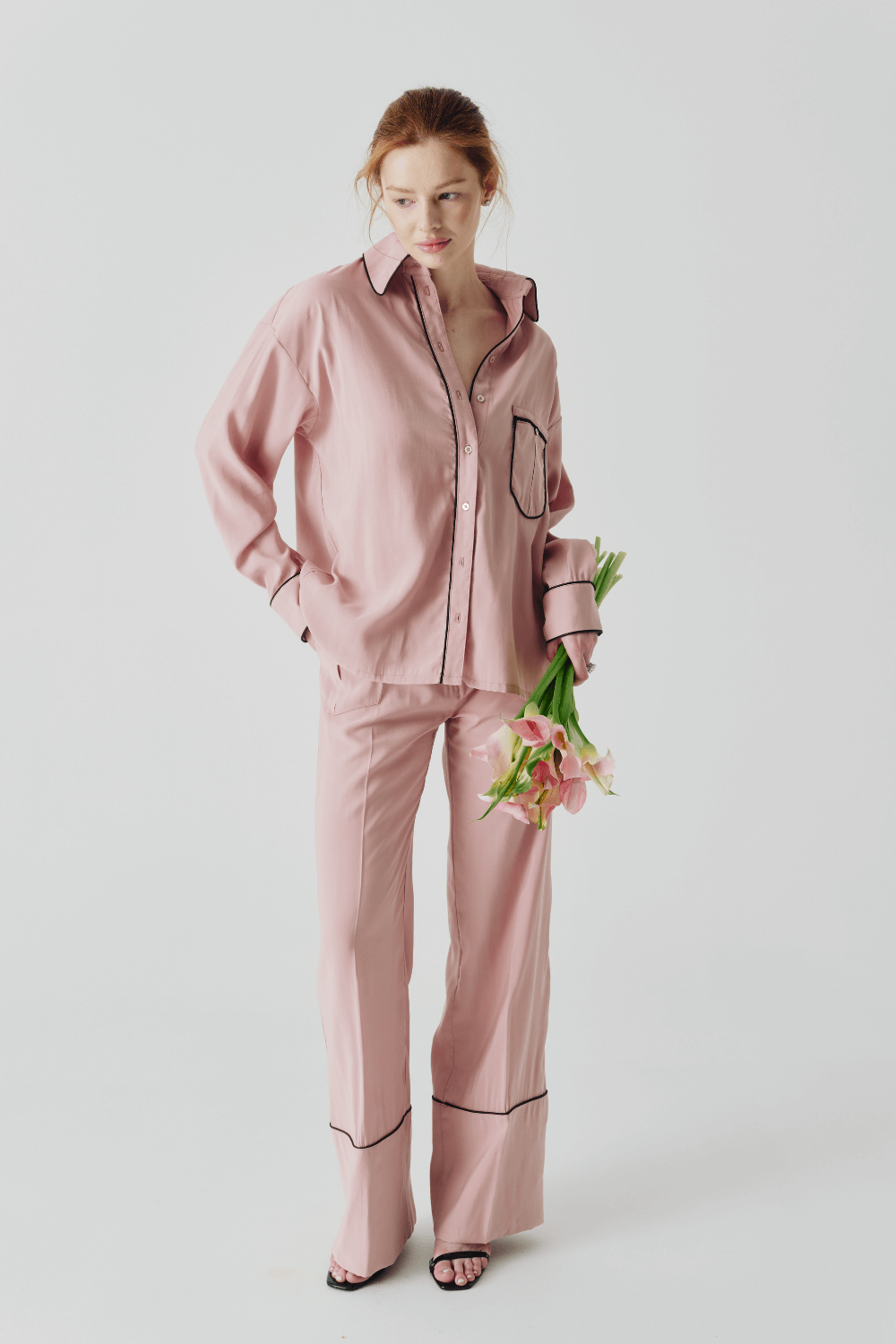 The suit is pink pajamas