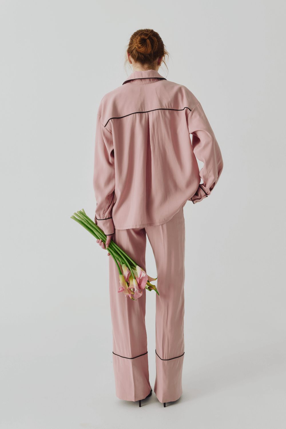 The suit is pink pajamas