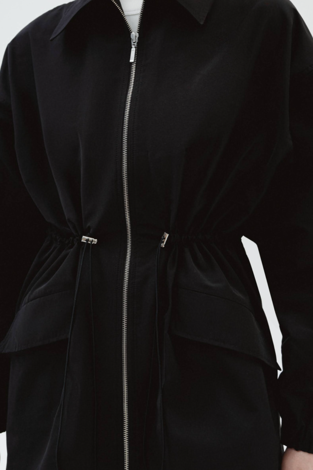 The raincoat is black