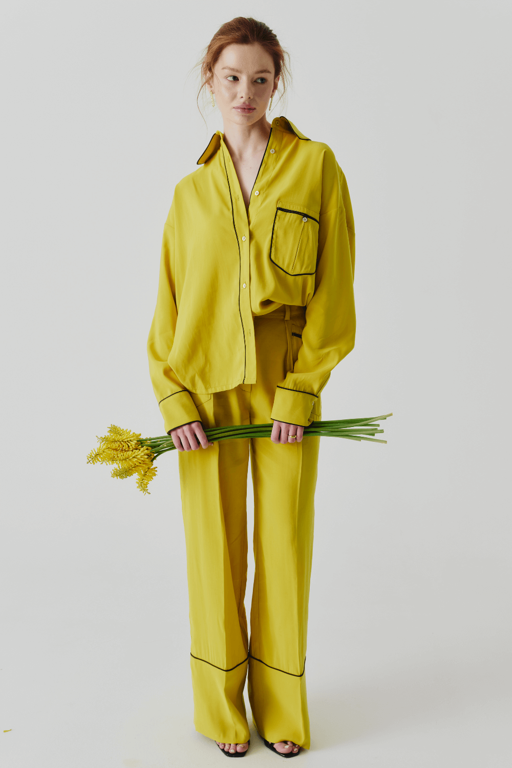 The suit is yellow pajamas