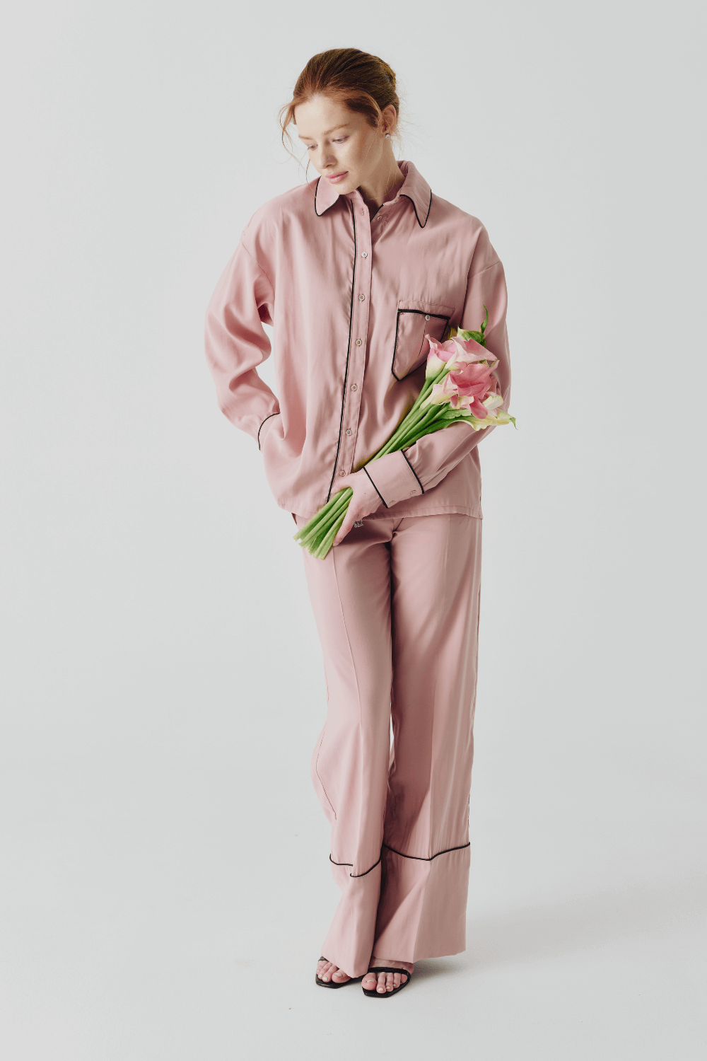 The suit is pink pajamas
