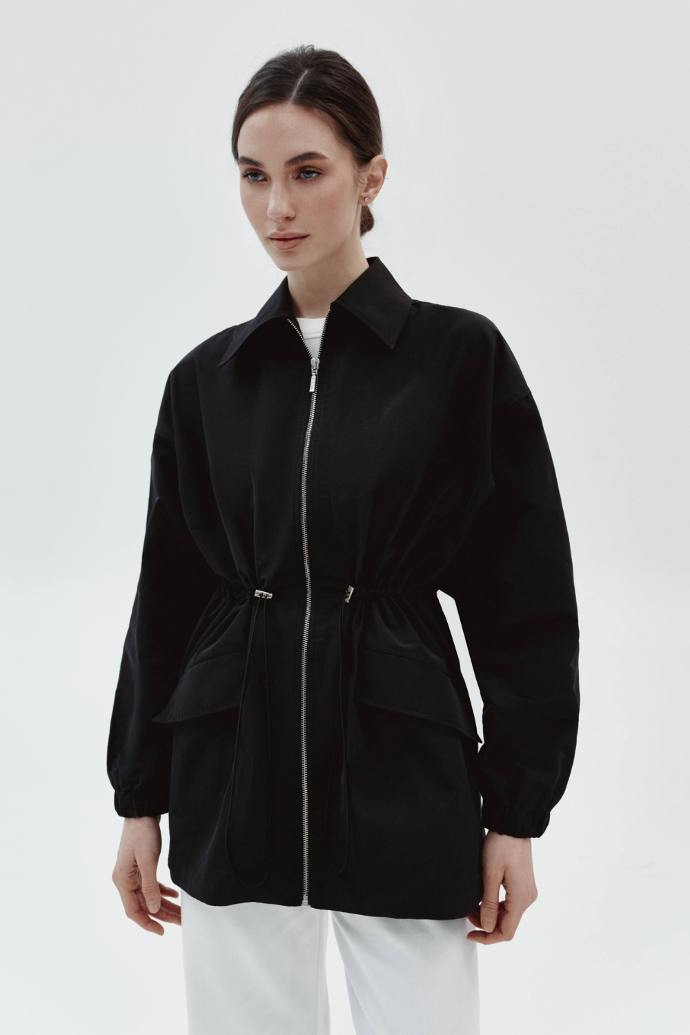 The raincoat is black