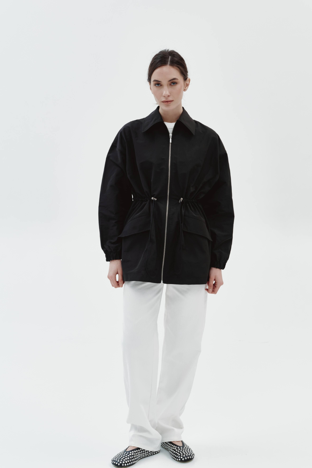 The raincoat is black